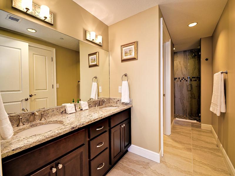 Full bathroom with his and hers sinks.